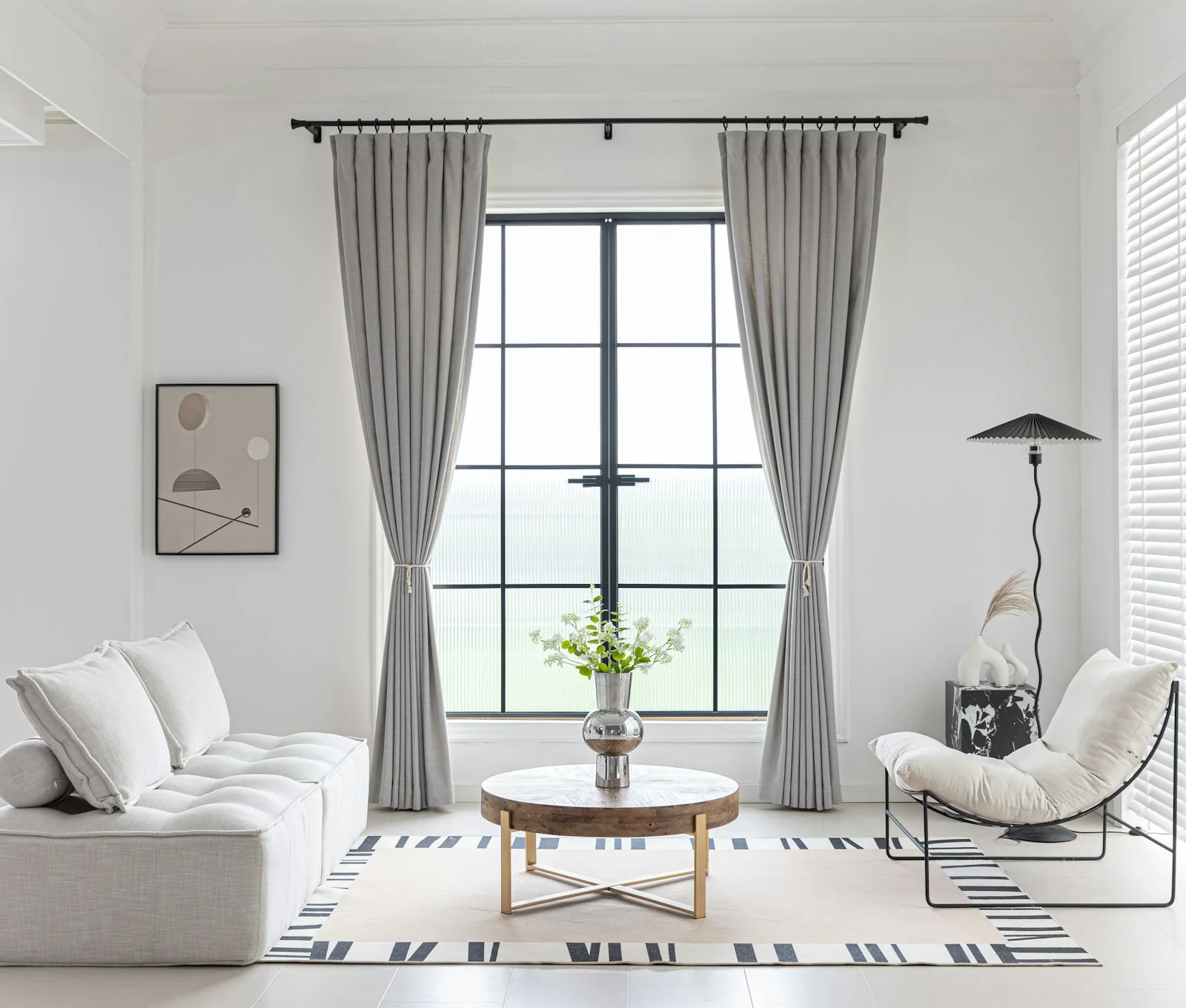 A softly lit living room with natural tones and contemporary furnishings